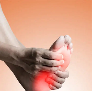 A hand gently cradles a foot with a glowing red area highlighting the arch, suggesting discomfort or pain.